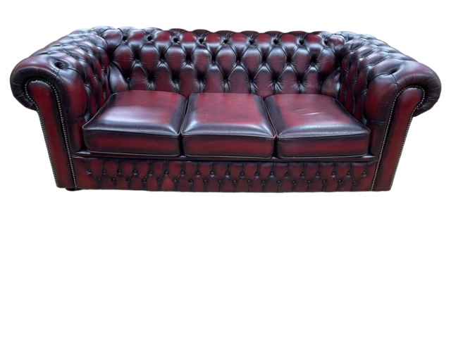 Ox blood deep buttoned leather three seater Chesterfield settee.