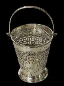 Victorian silver swing handle pierced basket, London 1896, 9cm high without handle.
