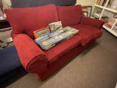 Contemporary two seater settee in red fabric.