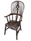 Antique yew wood braodarm Windsor pierced splat back chair.