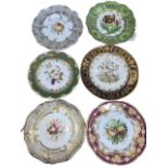 Seven assorted porcelain plates depicting flowers, fruit and birds.