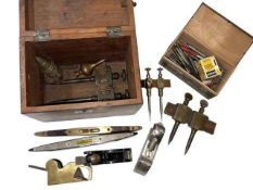 Box of vintage tools including levels, small planes, etc.