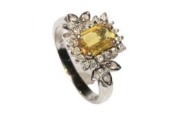 Yellow (Sapphire?) stone and diamond 14 carat white gold ring with emerald cut centre stone