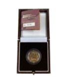 A Royal Mint fine gold 1/4 oz proof Britannia £25 2003 coin, boxed with certificate.