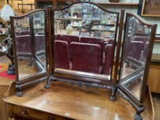 Edwardian mahogany triple bevelled dressing mirror on paw feet.