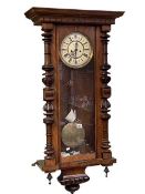 Victorian walnut double weight Vienna style wall clock having enamelled dial, 106cm.