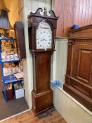 Antique oak cased eight day longcase clock having fruit and floral painted arched dial, signed T.