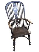 Antique yew wood pierced splat back Windsor elbow chair.