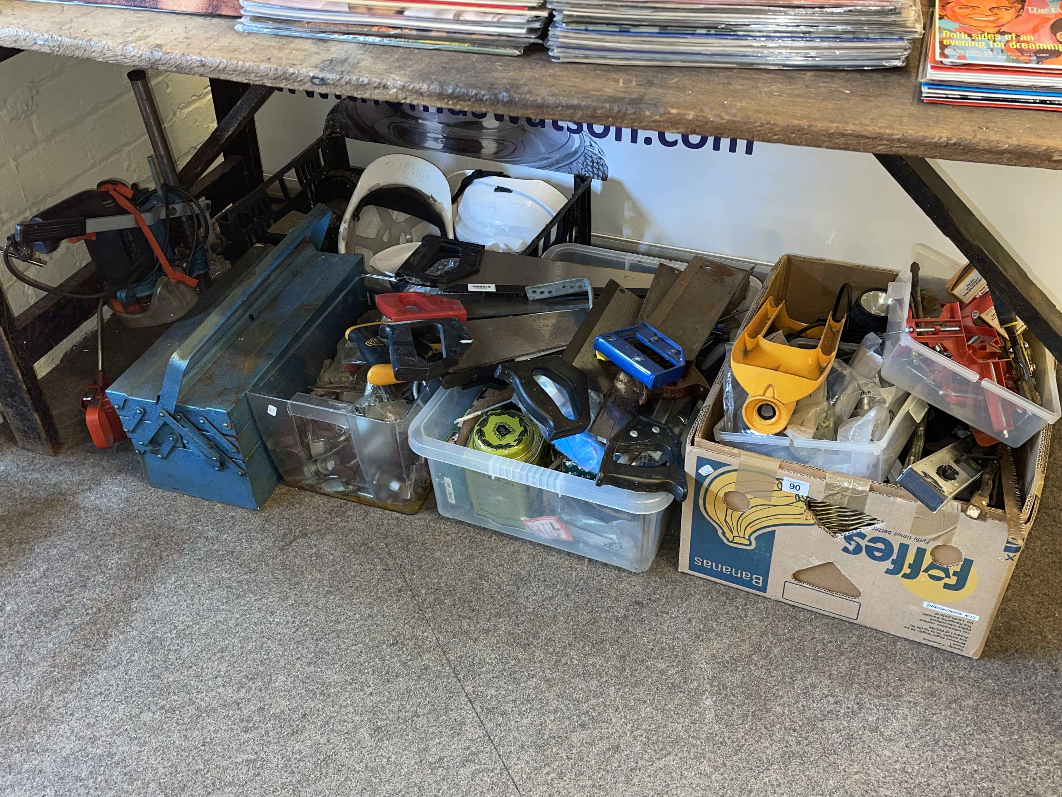 Collection of tools, helmets, oil cans, etc.
