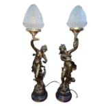 Two ornate bronzed effect lady table lamps.