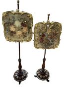 Pair Victorian rosewood and giltwood glazed needlework panel pole screens on triform base.