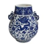 Large Chinese blue and white two handled bulbous vase decorated with dragons and flowers,