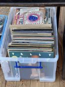 Box of LP records and singles.