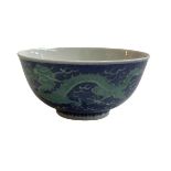 Chinese bowl decorated with green painted dragon on blue ground, blue Qianlong mark to base, 15cm.