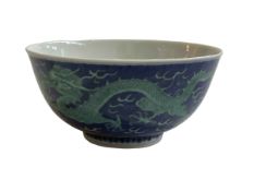 Chinese bowl decorated with green painted dragon on blue ground, blue Qianlong mark to base, 15cm.