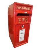 Red post box with keys.