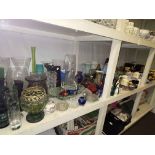 Full shelf of china and glass including Ringtons, coloured glass, slate and oak mantel clocks,
