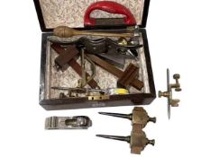 Box of vintage tools including spoke shave, plane, gauges, etc.