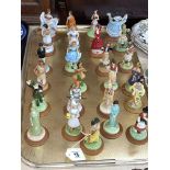 Twenty five Danbury Mint 'Lovely Ladies of Many Lands' with display stand.