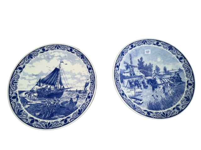 Pair of blue and white Delft wall plaques, 39.5cm diameter.