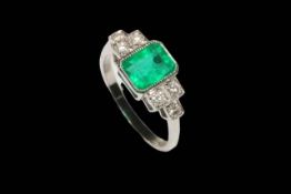 Emerald and diamond platinum ring, having approximately 1.