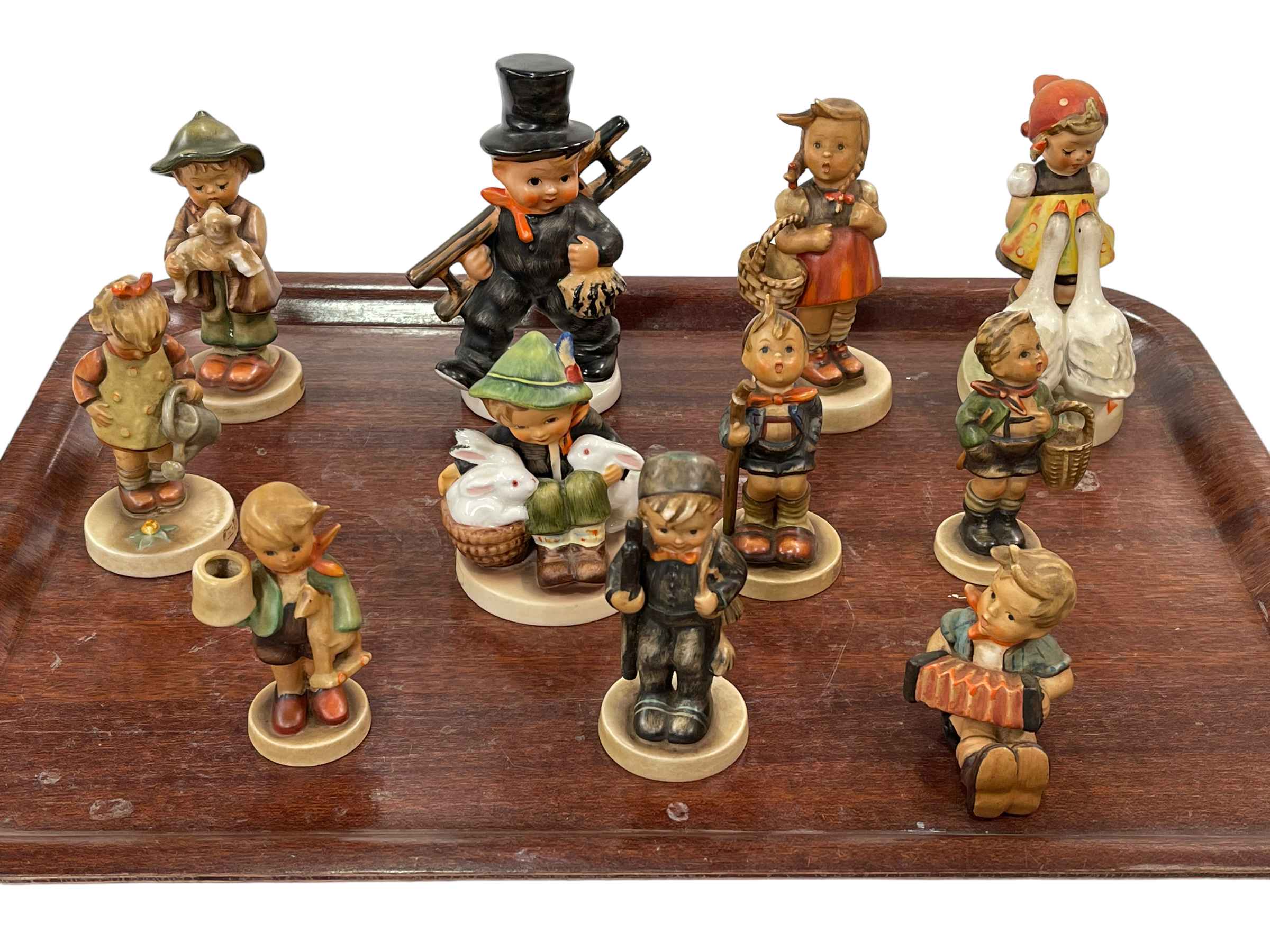 Collection of eleven Hummel figures.