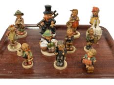 Collection of eleven Hummel figures.