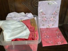 Box of Oriental fabrics.