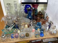 Collection of glass including perfume bottles, paperweights, decanters, coloured glass, etc.