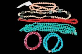 Six gemstone necklaces and bracelets including coral and turquoise.