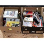 Two boxes of shooting related books, .22 calibre rifle cleaning kit, etc.