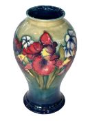 Moorcroft Pottery Orchid vase, bearing impressed mark and painted initials, 23cm.