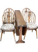 Ercol drop leaf table and set of four Ercol Fleur De Lys dining chairs.