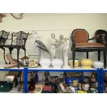 Collection of garden statues and pots including semi-nude ladies, heron, crocodile head, etc.