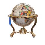 Semi-precious stone and brass bound globe with a compass base, 35cm high.
