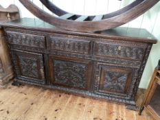 19th Century carved oak sideboard having three frieze drawers above a central carved panel flanked