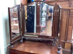 Edwardian mahogany triple bevelled dressing mirror on paw feet.