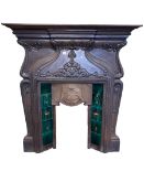 Art Nouveau cast iron and tiled fireplace, 149cm by 128cm.
