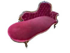 Victorian walnut framed chaise longue with serpentine front seat in wine buttoned draylon.