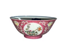 Chinese porcelain bowl with Famille Rose and floral outer pattern and blue and white interior