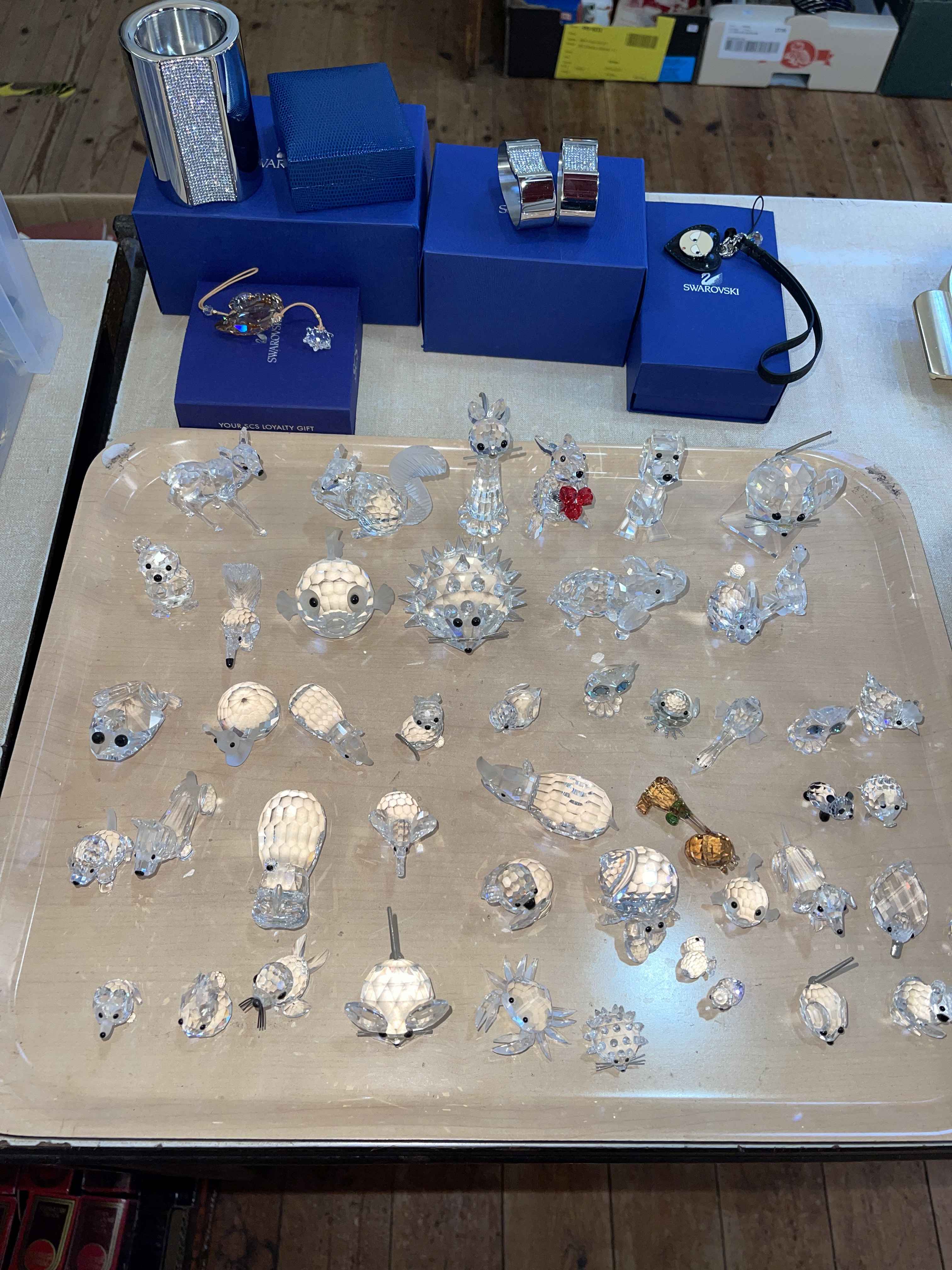 Large collection of Swarovski glass animals, napkin rings, etc.