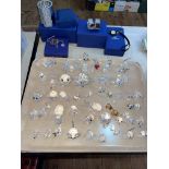 Large collection of Swarovski glass animals, napkin rings, etc.