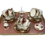 Six Royal Albert Old Country Roses cups and saucers, ring stand, bell and basket.