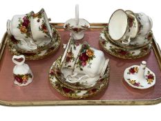 Six Royal Albert Old Country Roses cups and saucers, ring stand, bell and basket.