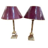A pair of tall brass columned table lamps and shades, 89cm.