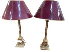 A pair of tall brass columned table lamps and shades, 89cm.