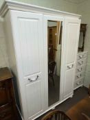 Contemporary white three door wardrobe and five drawer chest.