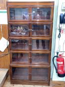 Early 20th Century mahogany five height bookcase with ten bevelled glass doors, 174.