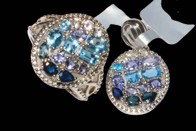 Ornate gem set silver ring and pendant (2).