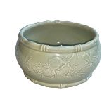 Chinese Celadon bowl with raised fruit on branch decoration, impressed seal mark to base,